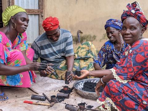 Three women gathering together and working